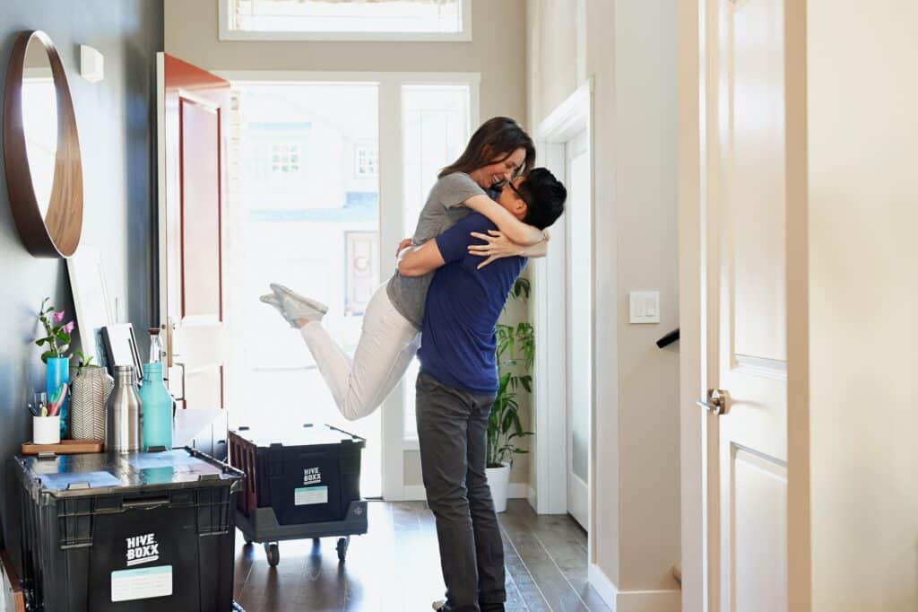 A couple after moving to their new Washington, DC home