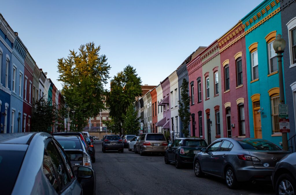 A street in Washington DC with colorful buildings on each side