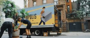 Movers loading a van in a street in New York City
